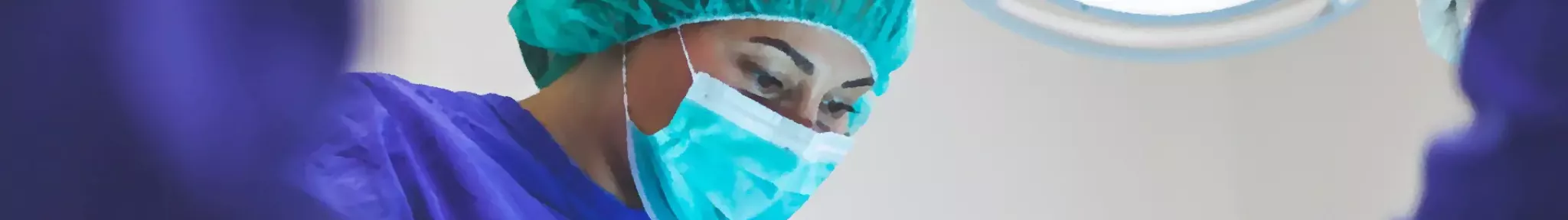 A surgeon is observing a patient out of view